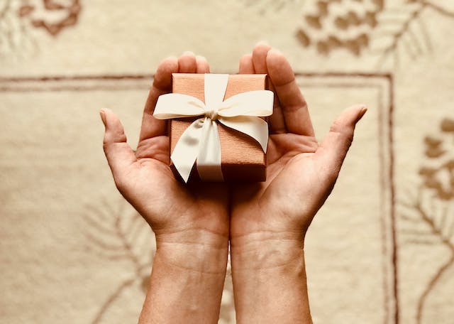 gift being handed to someone else