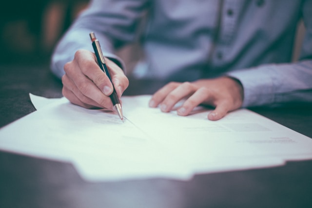 person signing contracts