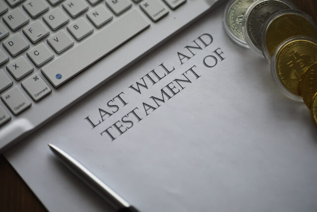 A document titled "Last Will and Testament Of" sits on a desk next to a pen, part of a keyboard, and several gold and silver coins—reminding us what happens if an executor fails to act on someone's final wishes.